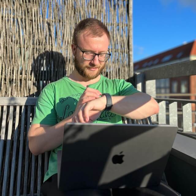Me working on my laptop and adjusting my watch
